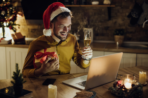 Male celebrating over Zoom photo for holiday messaging post
