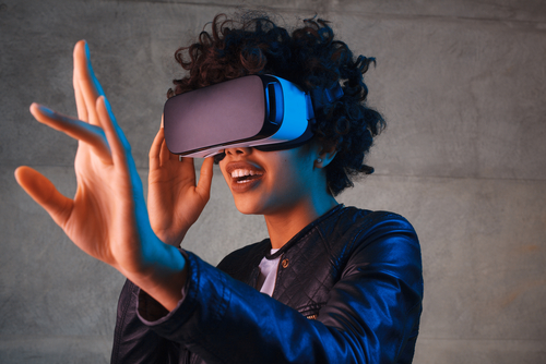 Woman with VR headset photo for website redesign post