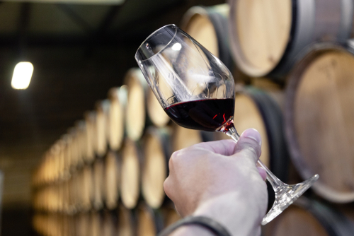 Winemaker tasting in barrel room photo for marketing refresh post