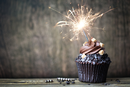 Cupcake with sparkler photo for anniversary celebrations post