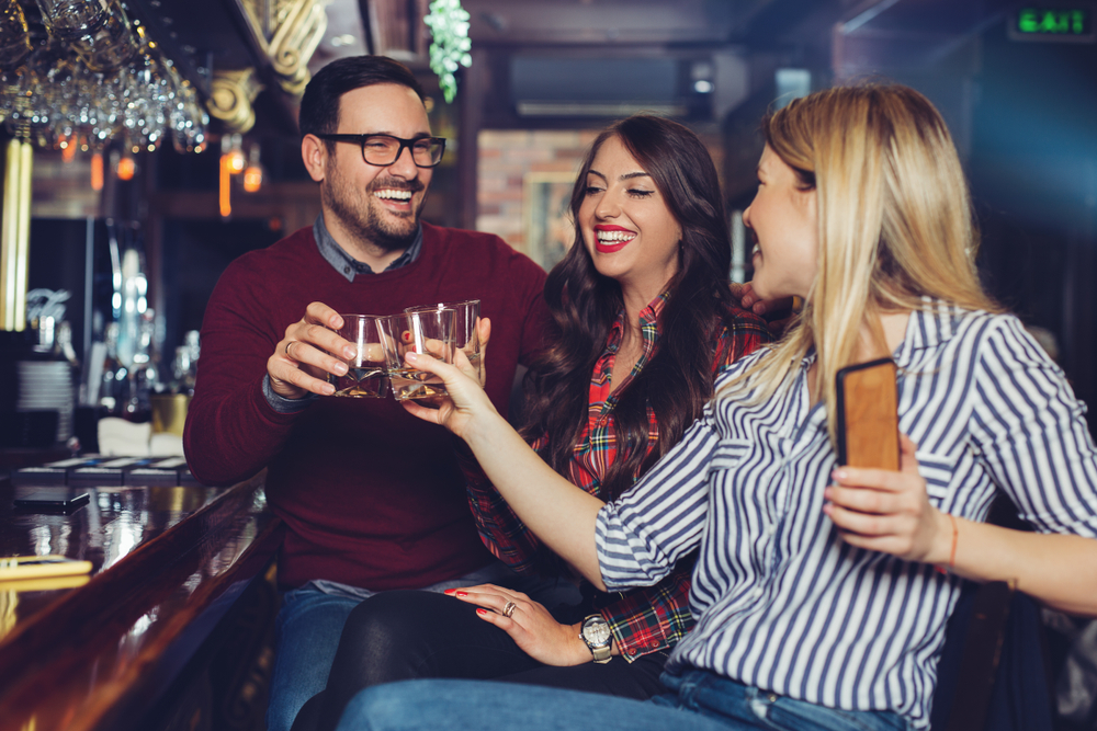 Friends at a bar for who needs alcohol post